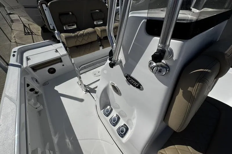 Slide: The Image of 2026 Blazer PureBay 2200 boat interior with console and seating details. - 16