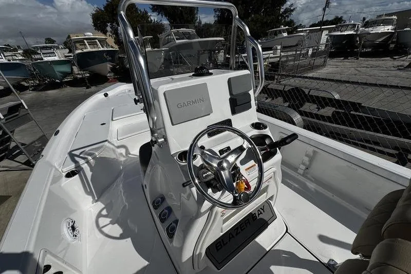 Slide: The Image of 2026 Blazer PureBay 2200 boat interior with Garmin navigation system. - 17