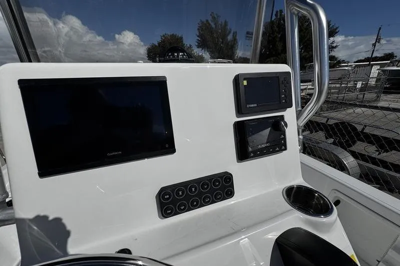 Slide: The Image of 2026 Blazer PureBay 2200 boat console with navigation screens and control panel. - 19