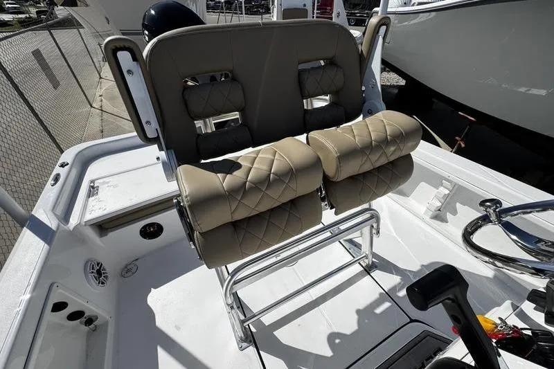 Slide: The Image of 2026 Blazer PureBay 2200 boat with cushioned seating and sleek design. - 22