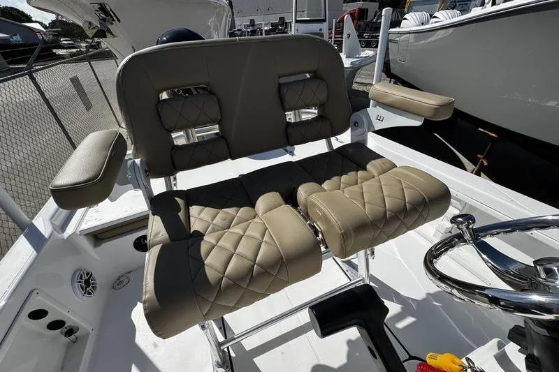 Slide: The Image of 2026 Blazer PureBay 2200 boat with luxurious quilted seating and modern steering wheel. - 23