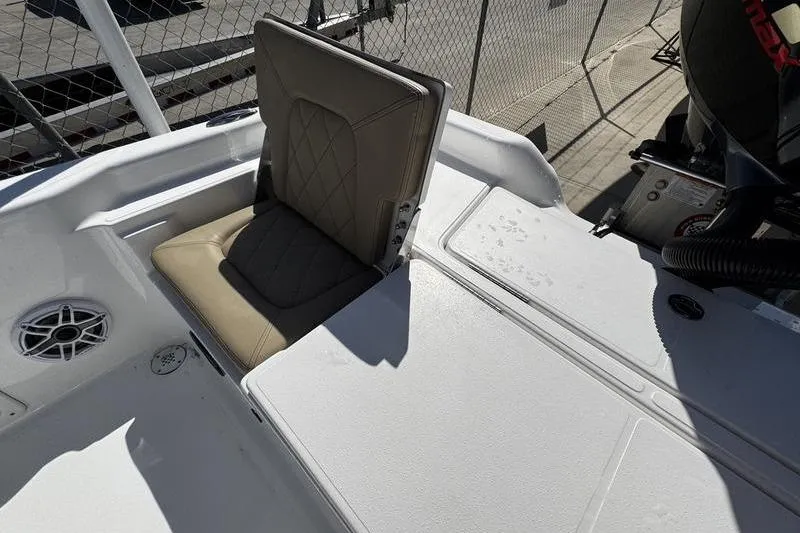 Slide: The Image of 2026 Blazer PureBay 2200 boat interior with cushioned seat and speaker. - 26