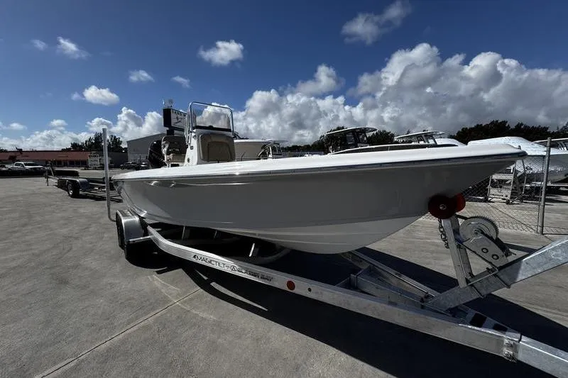 Slide: The Image of 2026 Blazer PureBay 2200 boat on trailer under blue sky. - 5