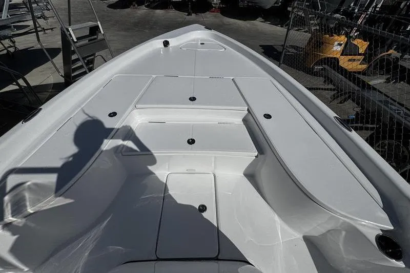 Slide: The Image of 2026 Blazer PureBay 2200 boat deck with storage compartments and sleek design. - 8