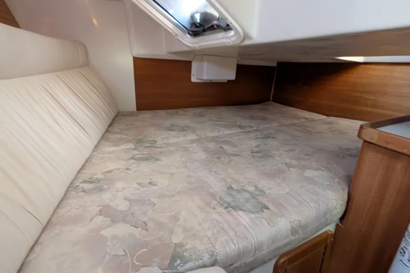 Slide: The Image of Cozy cabin interior of 2003 Catalina 34 MkII sailboat with comfortable bedding. - 13