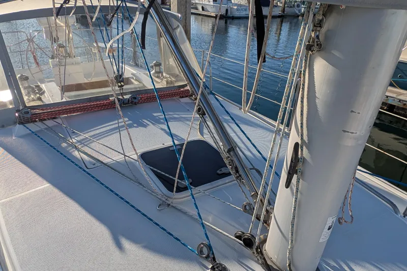 Slide: The Image of 2003 Catalina 34 MkII sailboat deck with rigging and mast in marina. - 20