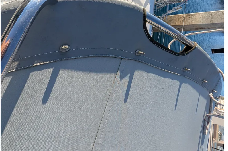 Slide: The Image of Close-up of a 2003 Catalina 34 MkII sailboat's canvas cover and railing. - 28