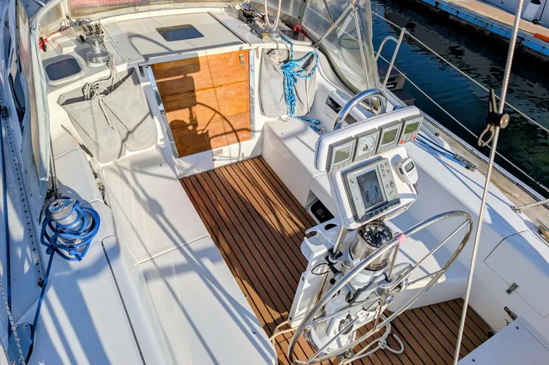 Slide: The Image of Cockpit of 2003 Catalina 34 MkII sailboat with navigation instruments and teak flooring. - 4