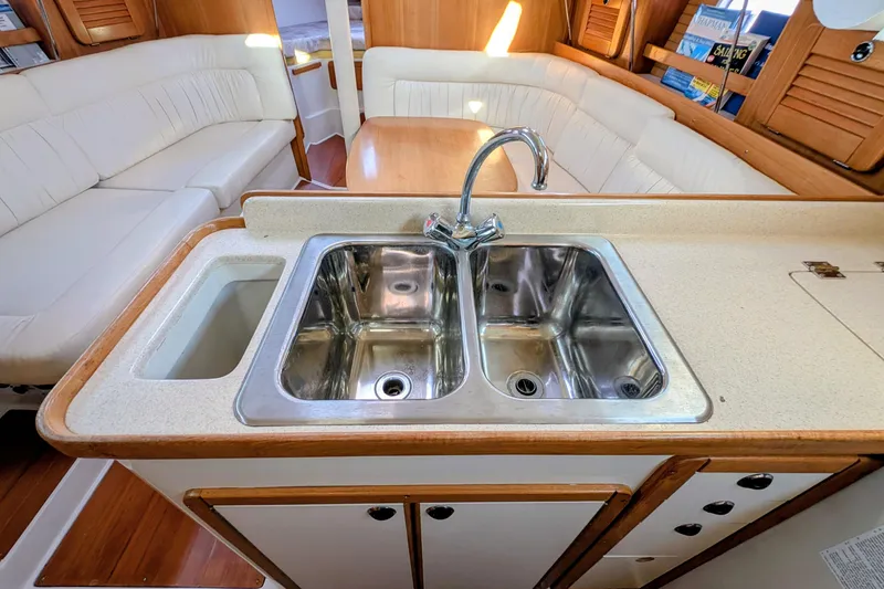 Slide: The Image of Interior of 2003 Catalina 34 MkII yacht with dual sink and seating area. - 7