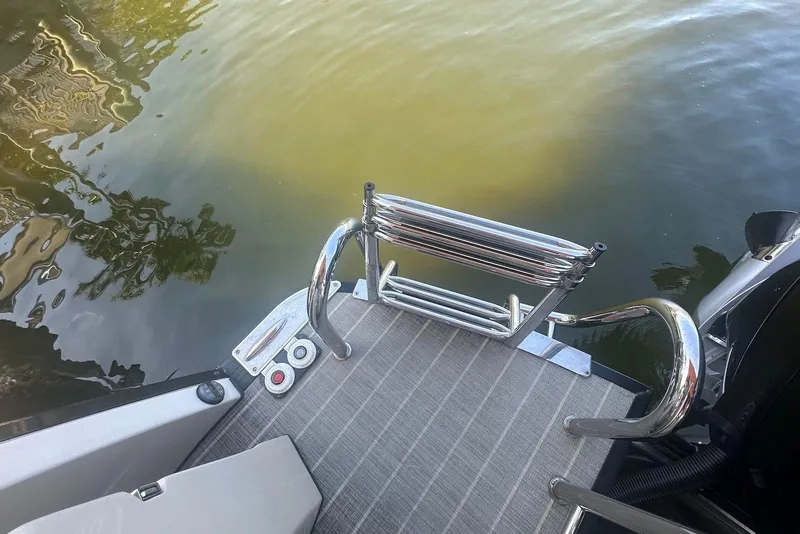 Slide: The Image of 2017 Harris V270 boat swim platform with stainless steel ladder on calm water. - 15