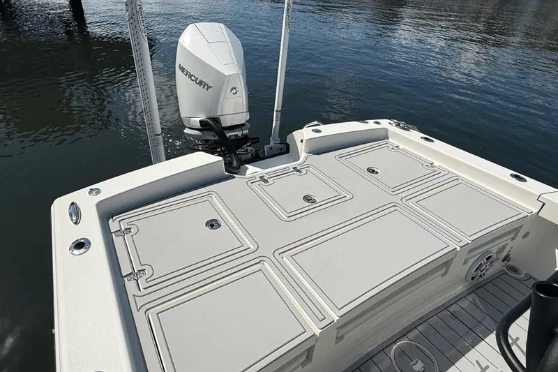 Slide: The Image of 2023 Pathfinder 2600 TRS boat with Mercury engine, featuring spacious deck and storage compartments. - 15