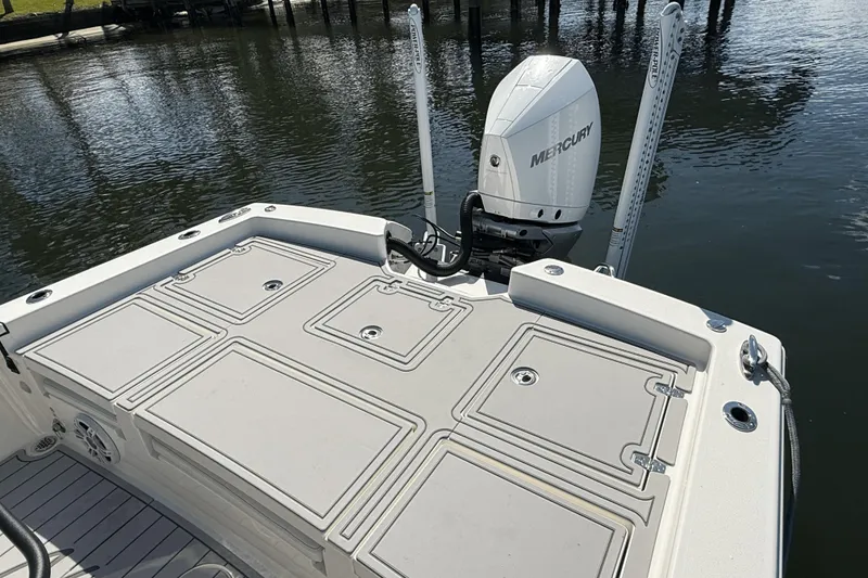 Slide: The Image of 2023 Pathfinder 2600 TRS boat with Mercury engine on calm water. - 17