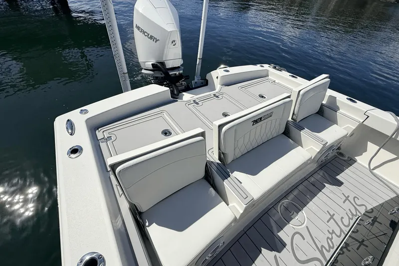 Slide: The Image of 2023 Pathfinder 2600 TRS boat with Mercury engine, featuring spacious seating and sleek design. - 18