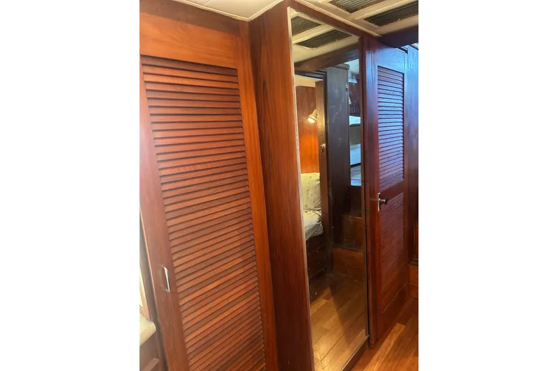 Slide: The Image of Interior of 1978 Chris-Craft 45 Commander with wooden paneling and mirrored door. - 28