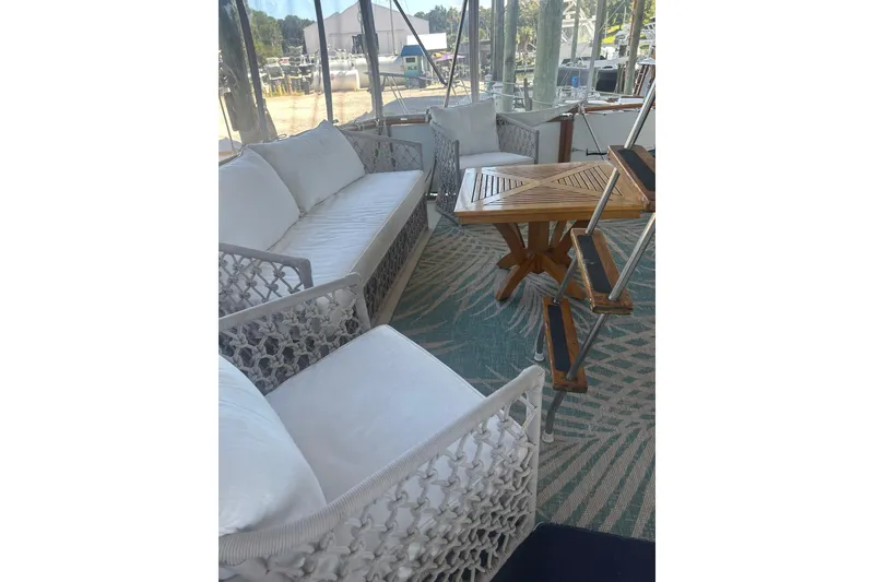 Slide: The Image of Luxurious seating area on 1978 Chris-Craft 45 Commander yacht with elegant white cushions. - 41