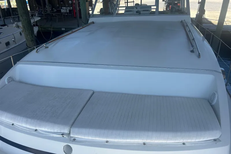 Slide: The Image of 1978 Chris-Craft 45 Commander yacht with spacious deck and cushioned seating. - 7