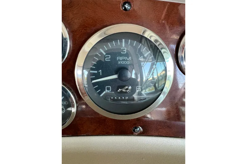 Slide: The Image of Tachometer of 1999 Sea Ray 290 Sundancer boat, displaying RPM gauge. - 20