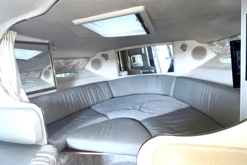 Slide: The Image of Interior of 1999 Sea Ray 290 Sundancer with spacious seating and modern design. - 27