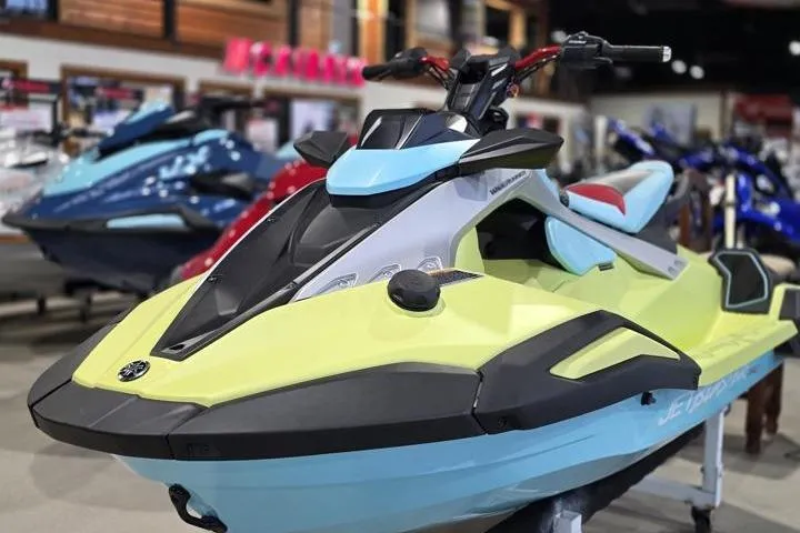 Slide: The Image of 2025 Yamaha WaveRunner JetBlaster PRO 3-Up in showroom, vibrant colors, sleek design. - 2