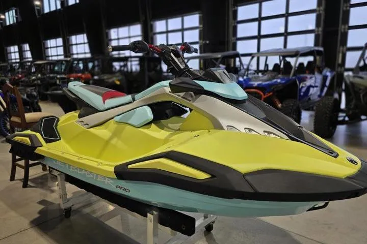 Slide: The Image of 2025 Yamaha WaveRunner JetBlaster PRO 3-Up in showroom, vibrant yellow and blue design. - 9