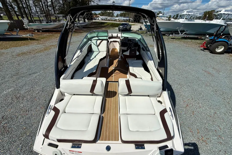 Slide: The Image of 2016 Regal 2300 Bowrider with spacious seating and sleek design on display outdoors. - 10