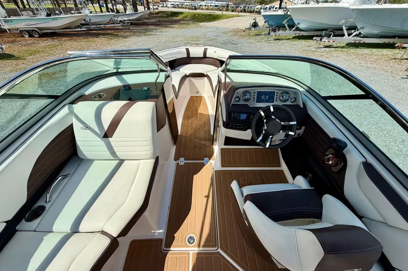 Slide: The Image of 2016 Regal 2300 Bowrider interior with sleek seating and modern dashboard design. - 16