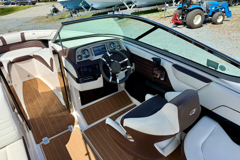 Slide: The Image of 2016 Regal 2300 Bowrider interior with sleek dashboard and comfortable seating. - 19
