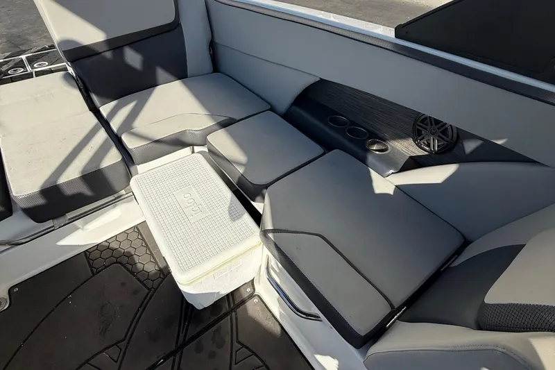 Slide: The Image of Interior seating of 2021 Scarab 255 ID boat with cooler and cup holders. - 11
