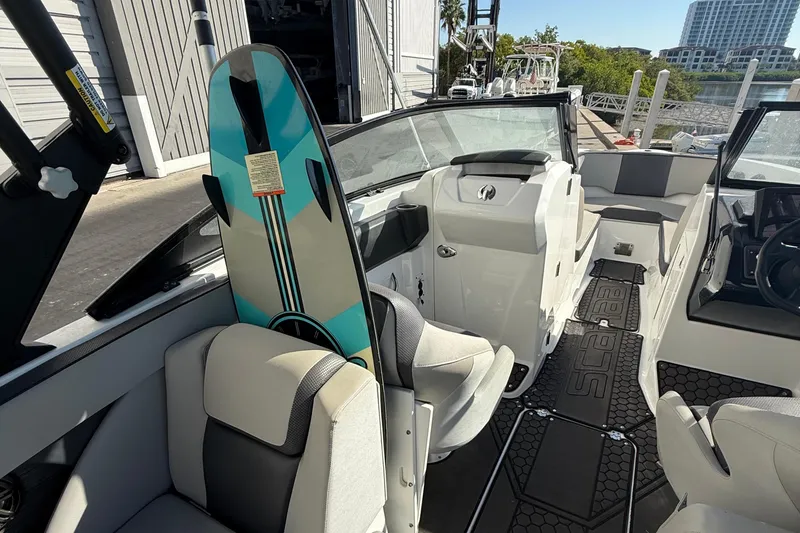 Slide: The Image of 2021 Scarab 255 ID boat interior with wakeboard, featuring modern seating and design. - 13