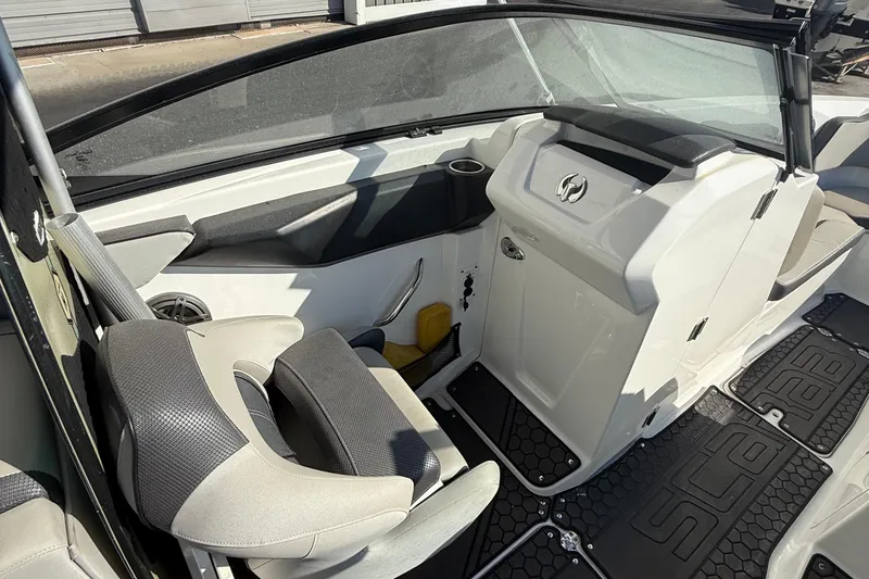 Slide: The Image of 2021 Scarab 255 ID boat interior with seating and dashboard details. - 17