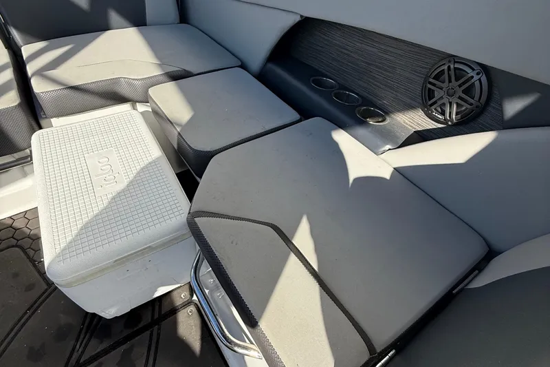 Slide: The Image of Interior of 2021 Scarab 255 ID boat with seating, cooler, and speaker. - 18