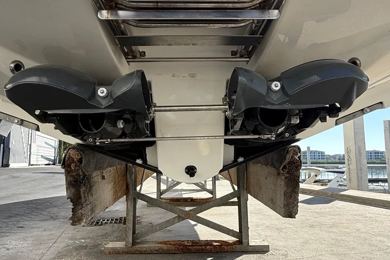 Slide: The Image of Rear view of 2021 Scarab 255 ID boat on a stand, showcasing dual jet drives. - 26