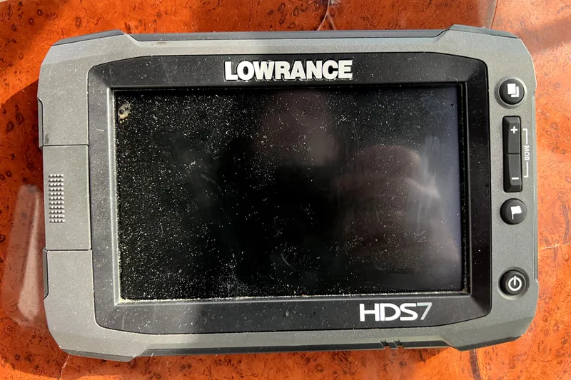Slide: The Image of Lowrance HDS7 marine GPS device on a 2007 Bayliner 305 boat dashboard. - 11