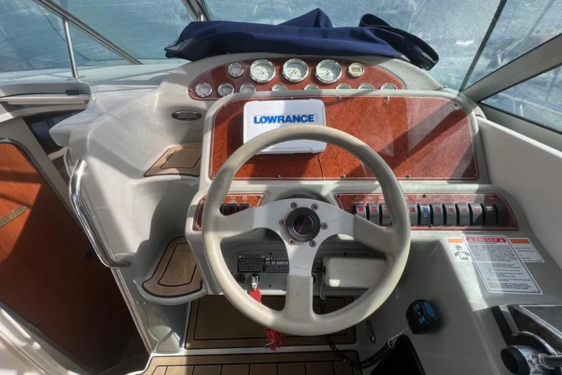 Slide: The Image of Steering console of a 2007 Bayliner 305 boat with Lowrance navigation system. - 7