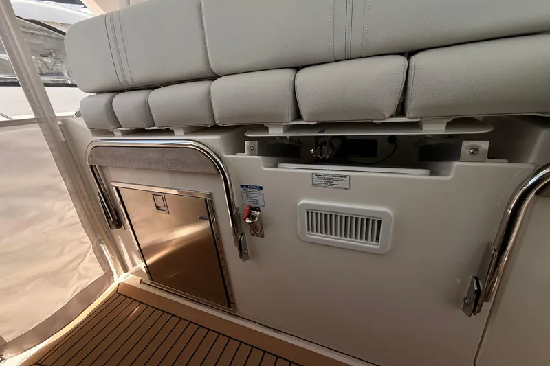 Slide: The Image of Interior view of 2022 Tiara Yachts 38 LS, featuring seating and storage area. - 17