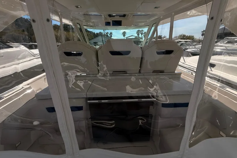 Slide: The Image of Interior view of 2022 Tiara Yachts 38 LS, showcasing seating and helm area. - 20