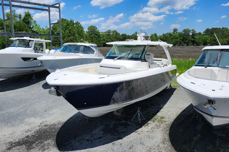 Slide: The Image of 2022 Tiara Yachts 38 LS boat displayed outdoors on a sunny day. - 28