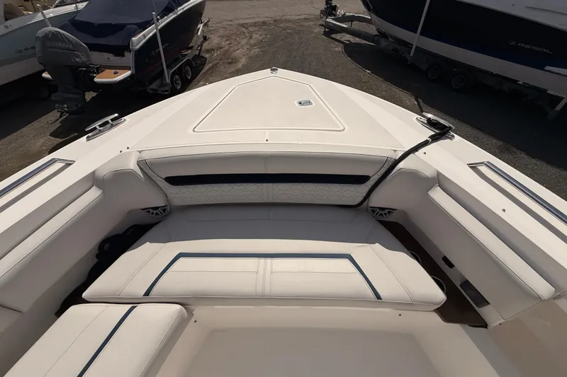 Slide: The Image of 2022 Tiara Yachts 38 LS boat interior with white seating and sleek design. - 3