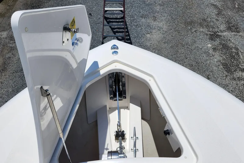 Slide: The Image of Open anchor compartment on 2022 Tiara Yachts 38 LS, showcasing storage and mechanism. - 31