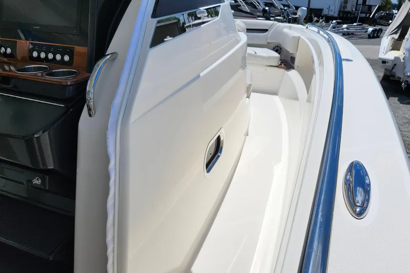 Slide: The Image of 2022 Tiara Yachts 38 LS boat interior with sleek design and modern controls. - 36
