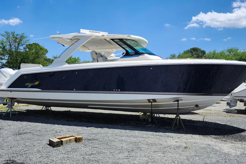 Slide: The Image of 2022 Tiara Yachts 38 LS boat on stands, clear sky background. - 40