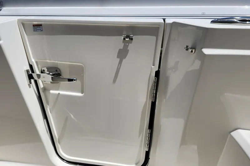 Slide: The Image of 2022 Tiara Yachts 38 LS boat door with chrome handle and sleek design. - 47