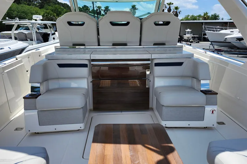 Slide: The Image of 2022 Tiara Yachts 38 LS interior with luxurious seating and sleek design. - 49