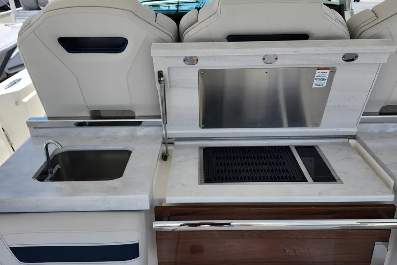 Slide: The Image of Luxury outdoor kitchen on 2022 Tiara Yachts 38 LS with sink and grill. - 50
