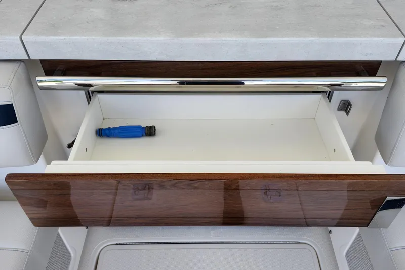 Slide: The Image of Open drawer in 2022 Tiara Yachts 38 LS, featuring sleek design and chrome handle. - 52