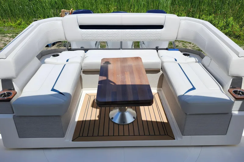 Slide: The Image of Luxurious seating area on 2022 Tiara Yachts 38 LS with elegant wooden table. - 53