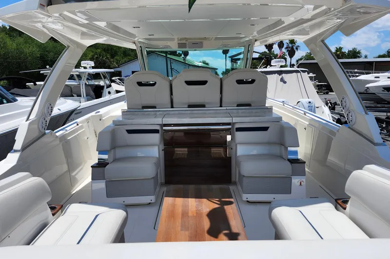 Slide: The Image of 2022 Tiara Yachts 38 LS luxury boat interior with sleek seating and modern design. - 55