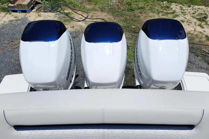 Slide: The Image of Triple Mercury outboard engines on a 2022 Tiara Yachts 38 LS boat. - 56