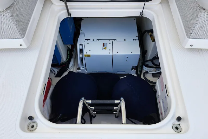 Slide: The Image of Engine compartment of 2022 Tiara Yachts 38 LS, showcasing mechanical components. - 59