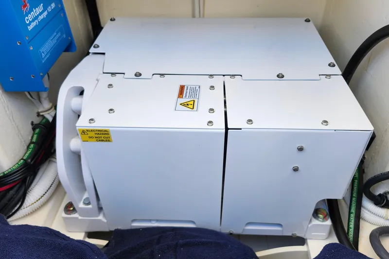 Slide: The Image of Electrical system in 2022 Tiara Yachts 38 LS, featuring battery charger and wiring. - 60